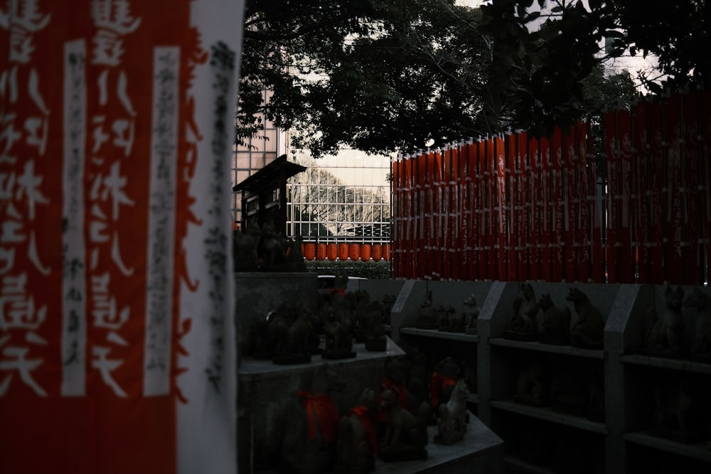 a red fence and some red and white signs