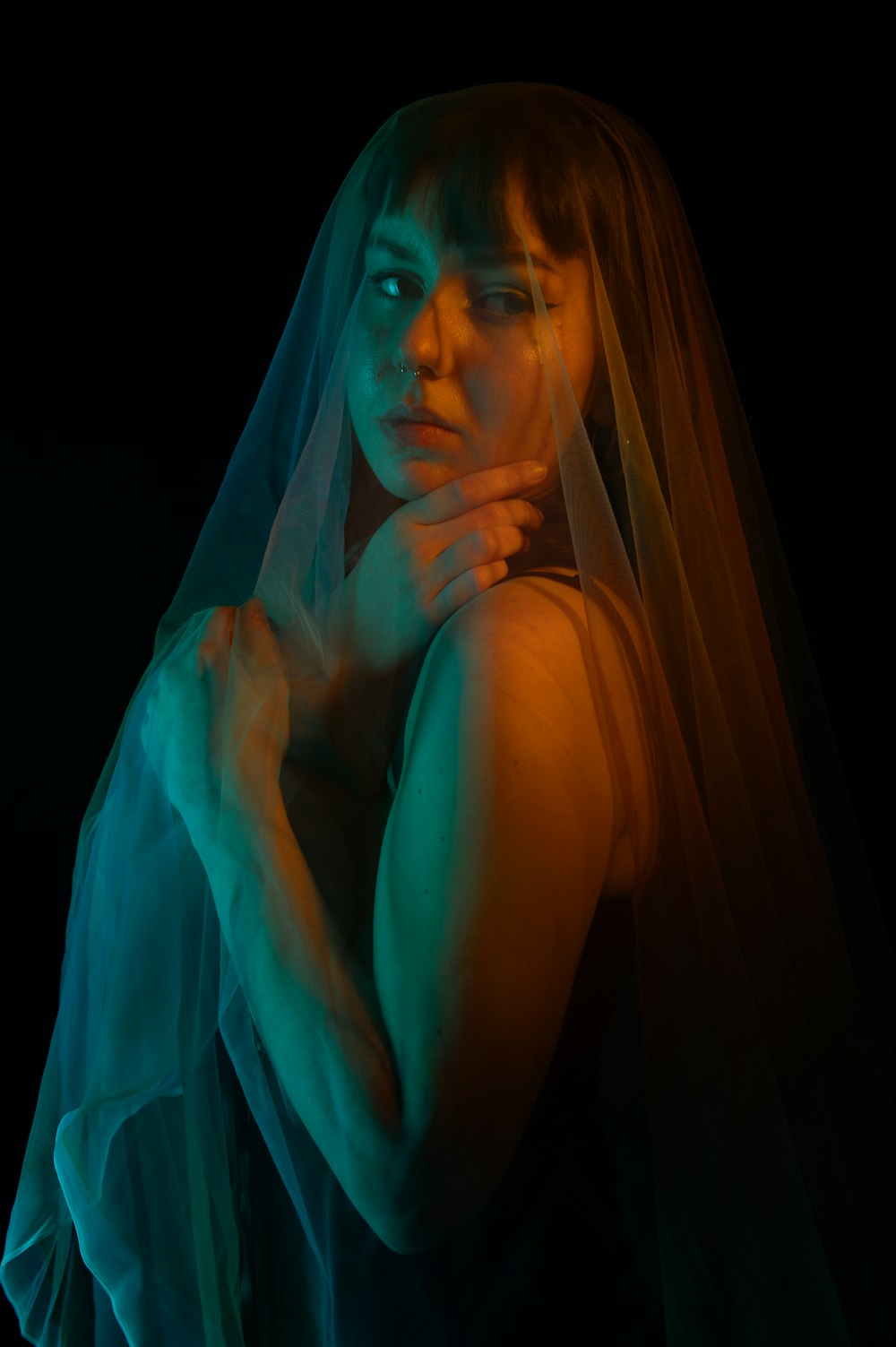 a woman wearing a veil and posing for a picture