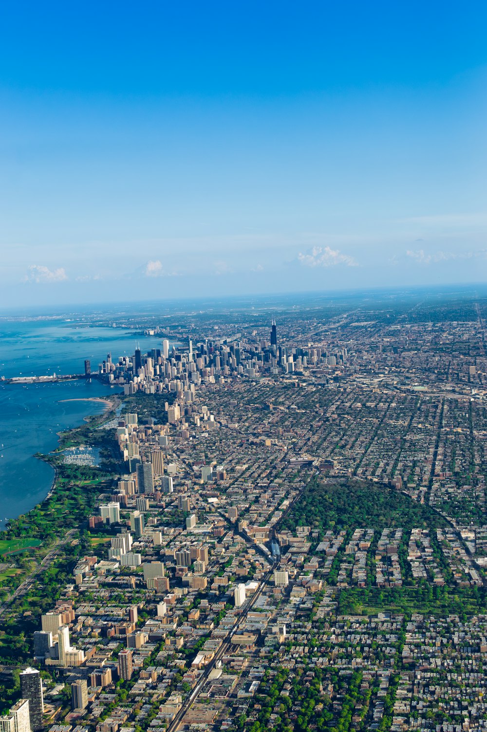 an aerial view of a city and a body of water