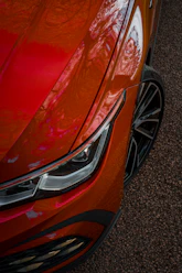 a close up of the front of a red car
