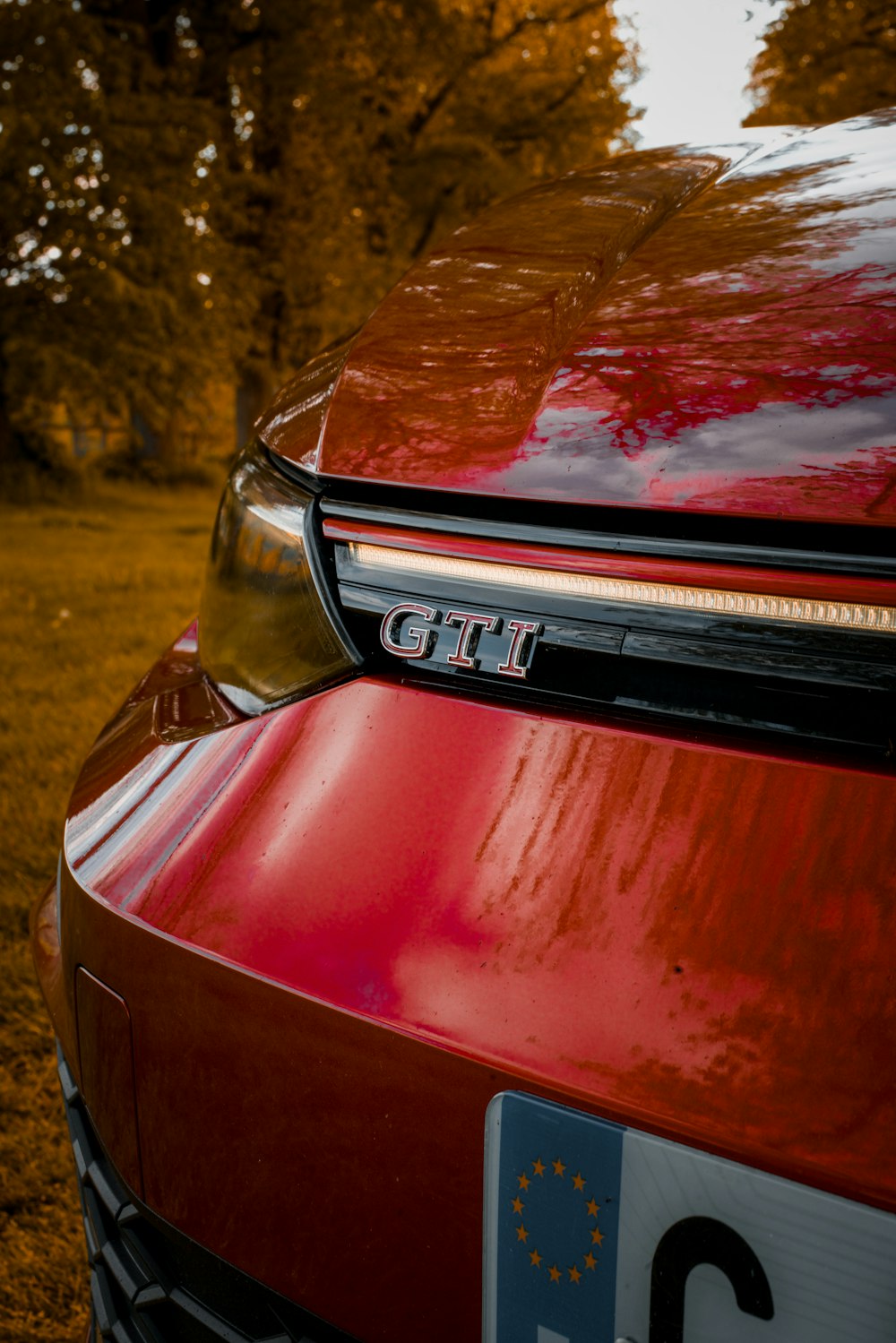 a close up of the front of a red car