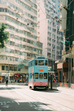 a double decker bus driving down a city street