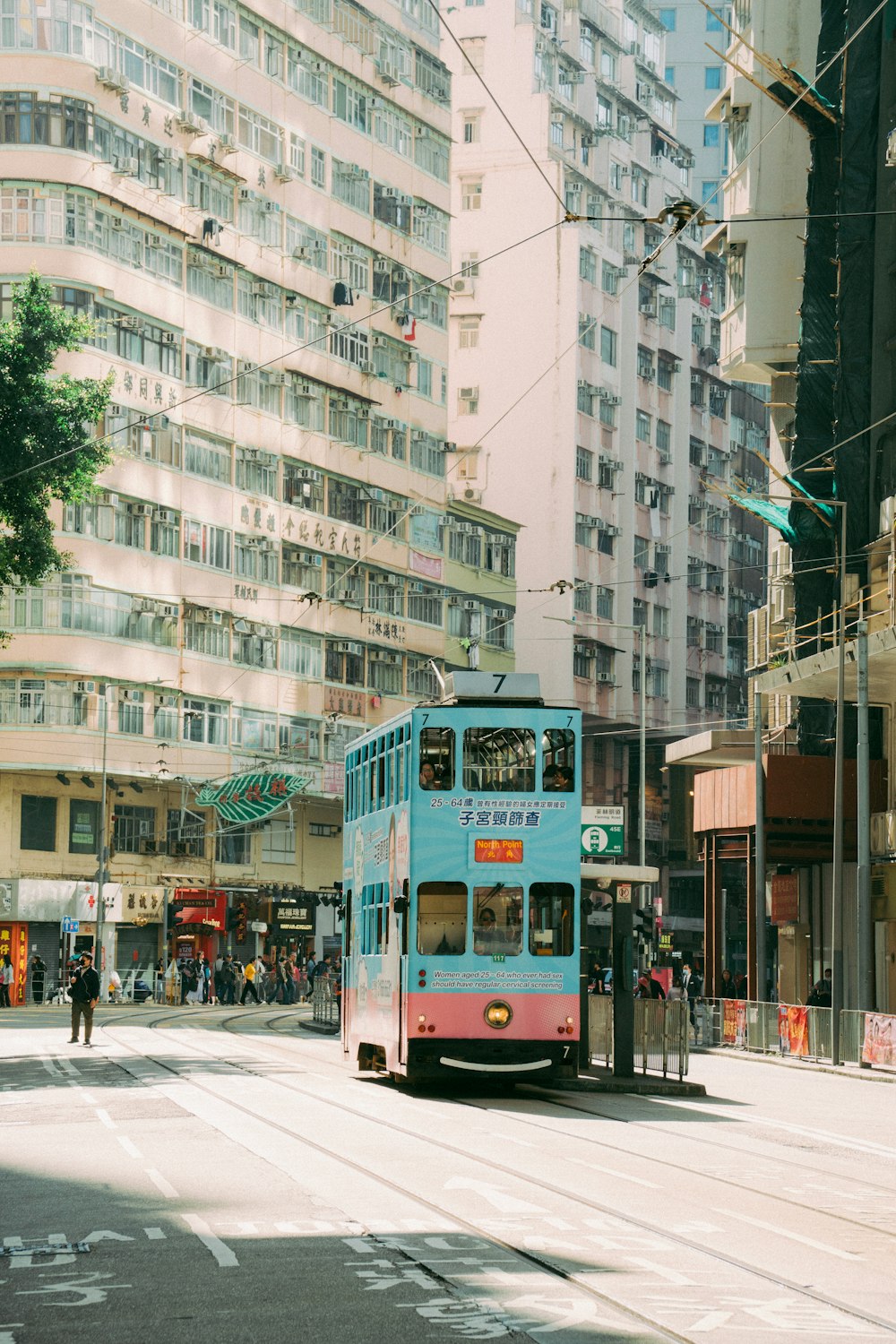 a double decker bus driving down a city street