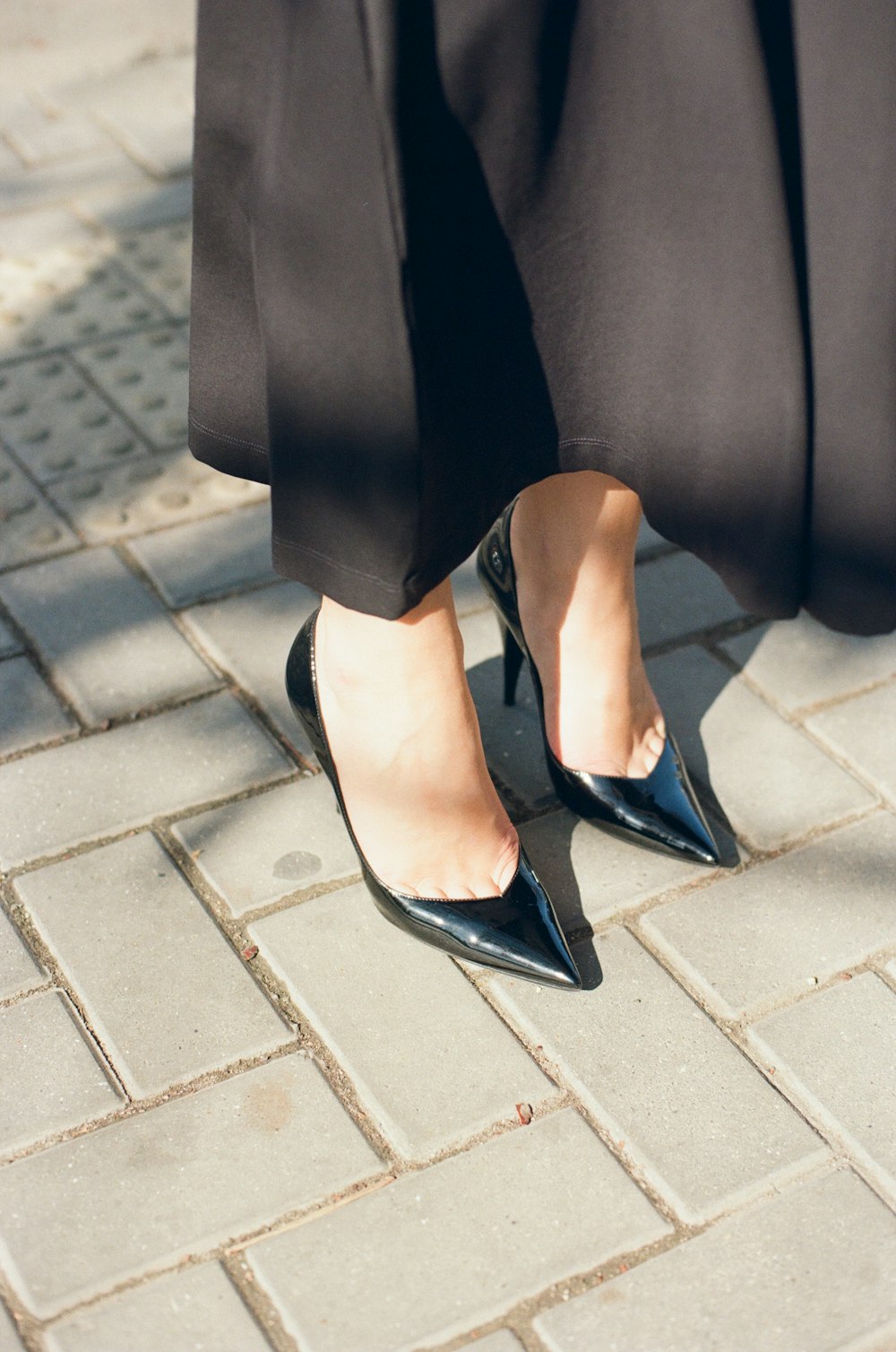 a close up of a person wearing black shoes