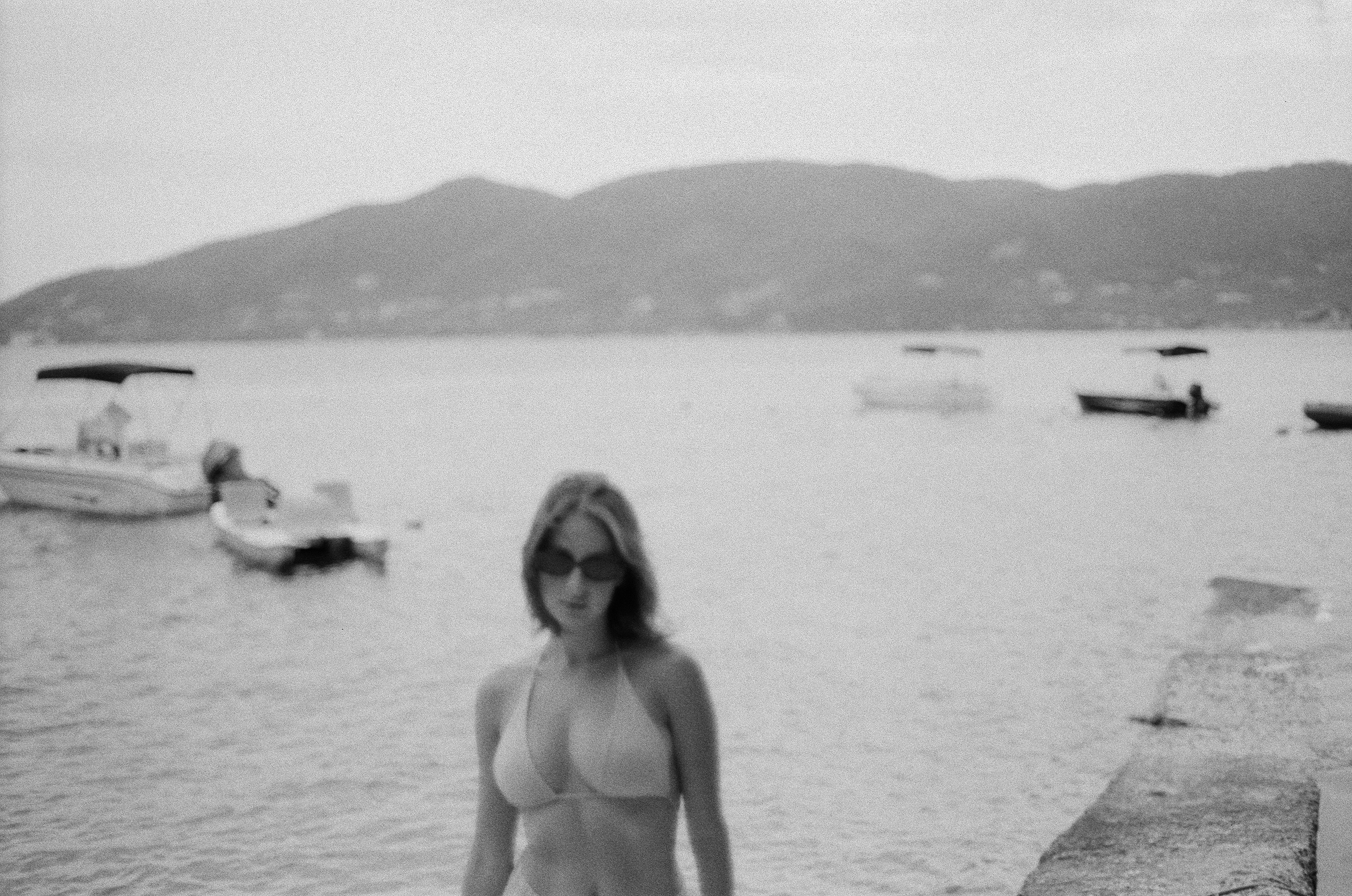 a woman in a bikini standing in the water
