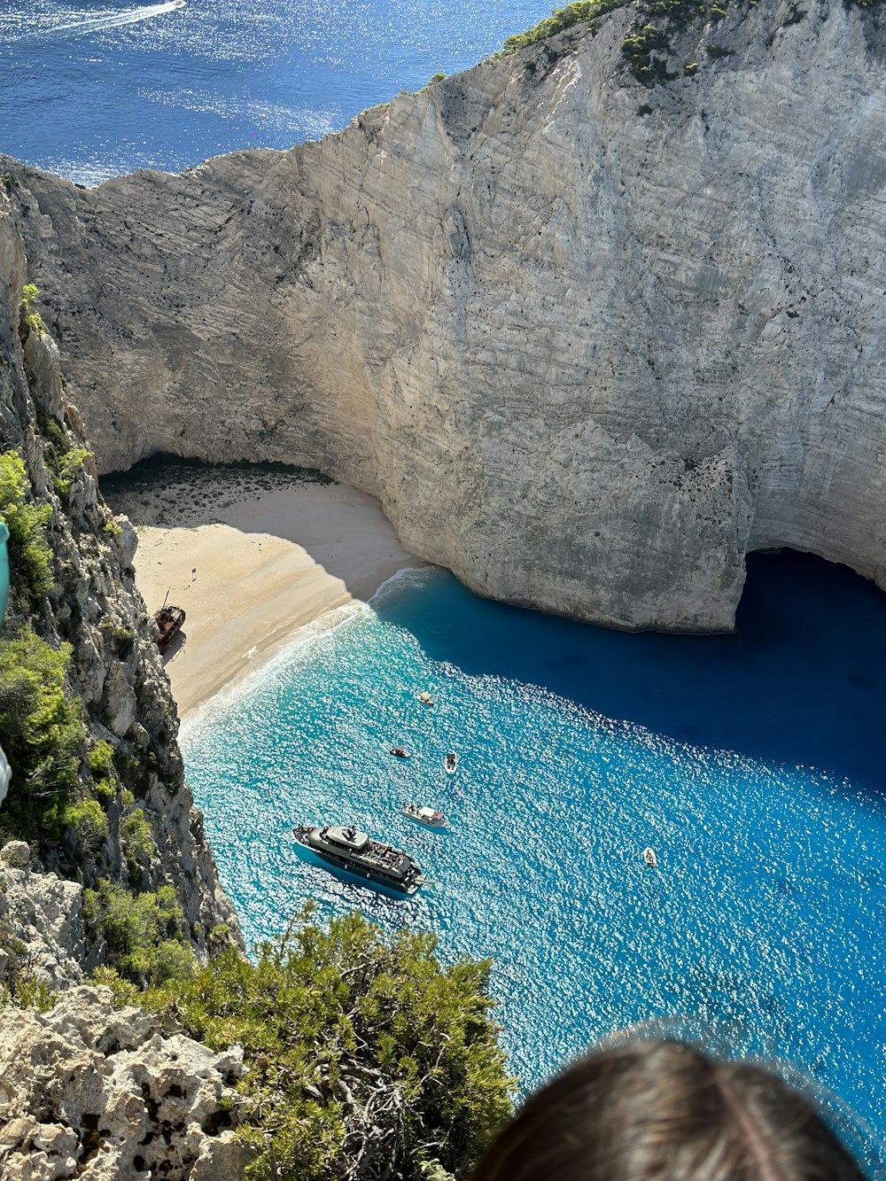 a group of boats floating on top of a body of water