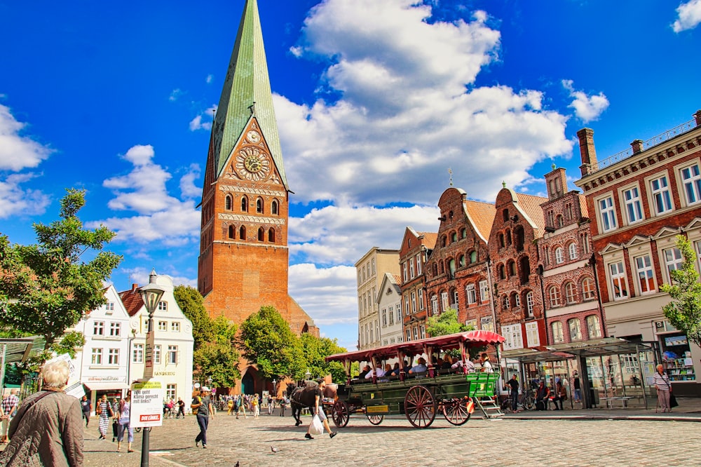 a horse drawn carriage on a cobblestone street