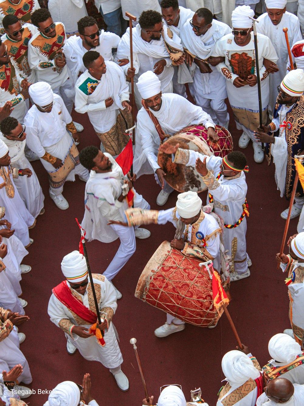 a large group of people in white outfits