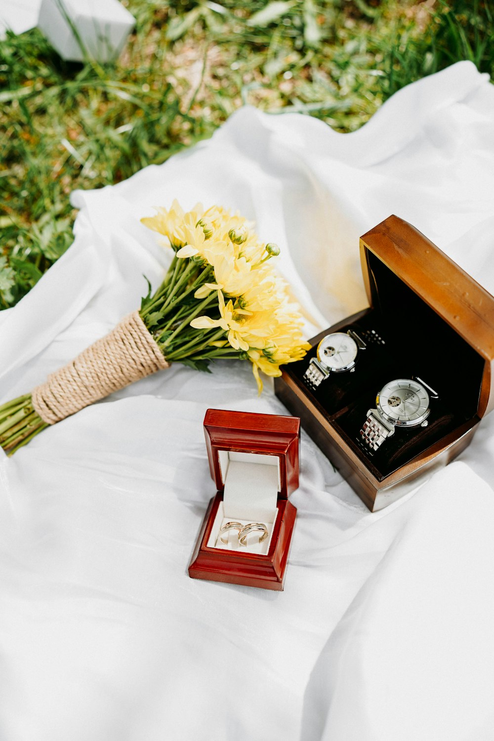 a couple of rings and a bouquet of flowers