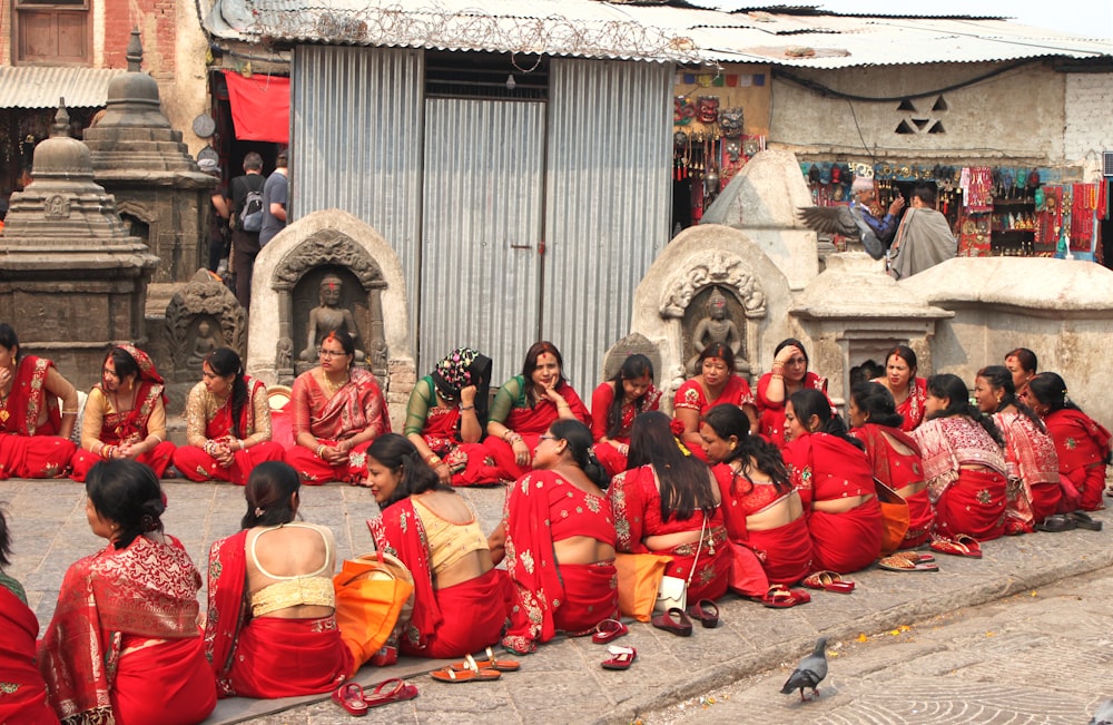 a group of women sitting next to each other