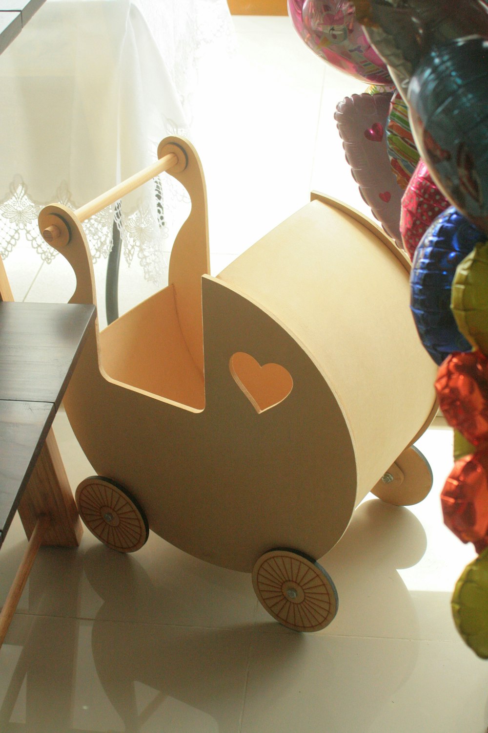 a wooden toy car sitting on top of a table