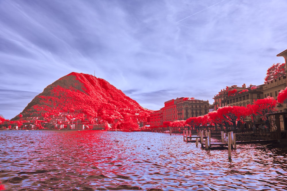 a body of water with a mountain in the background