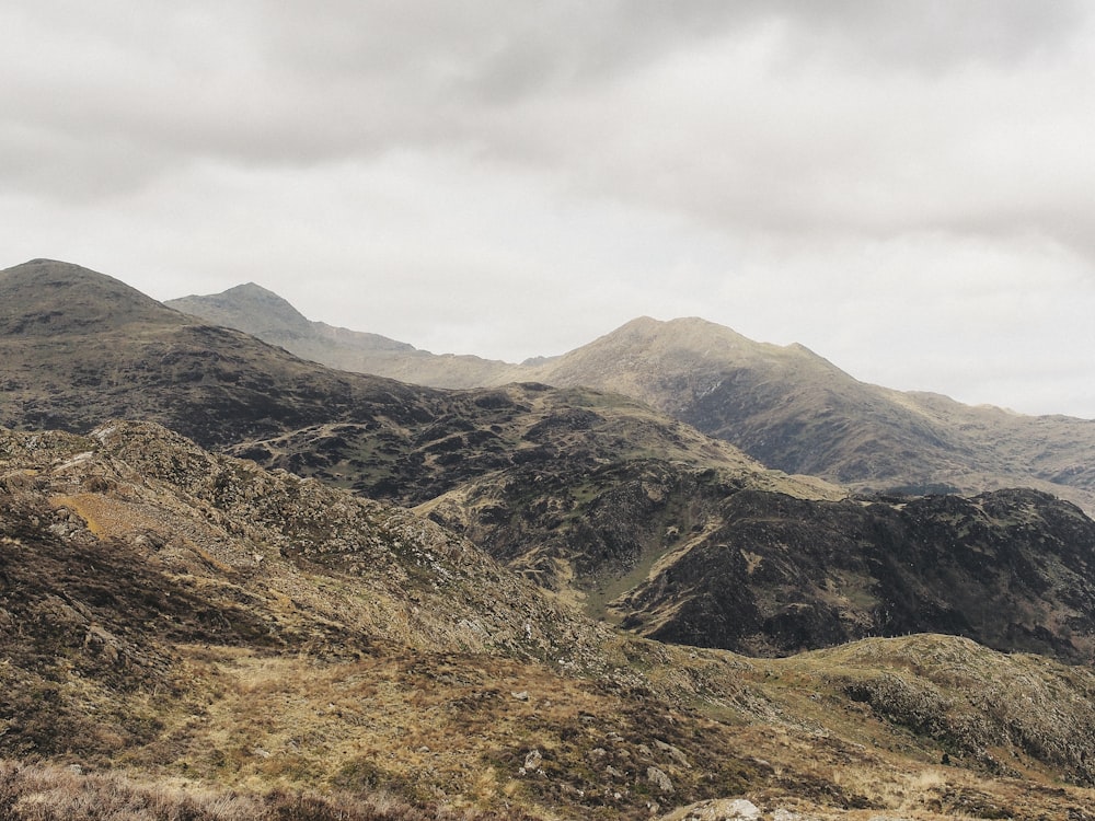 a view of a mountain range with a cloudy sky