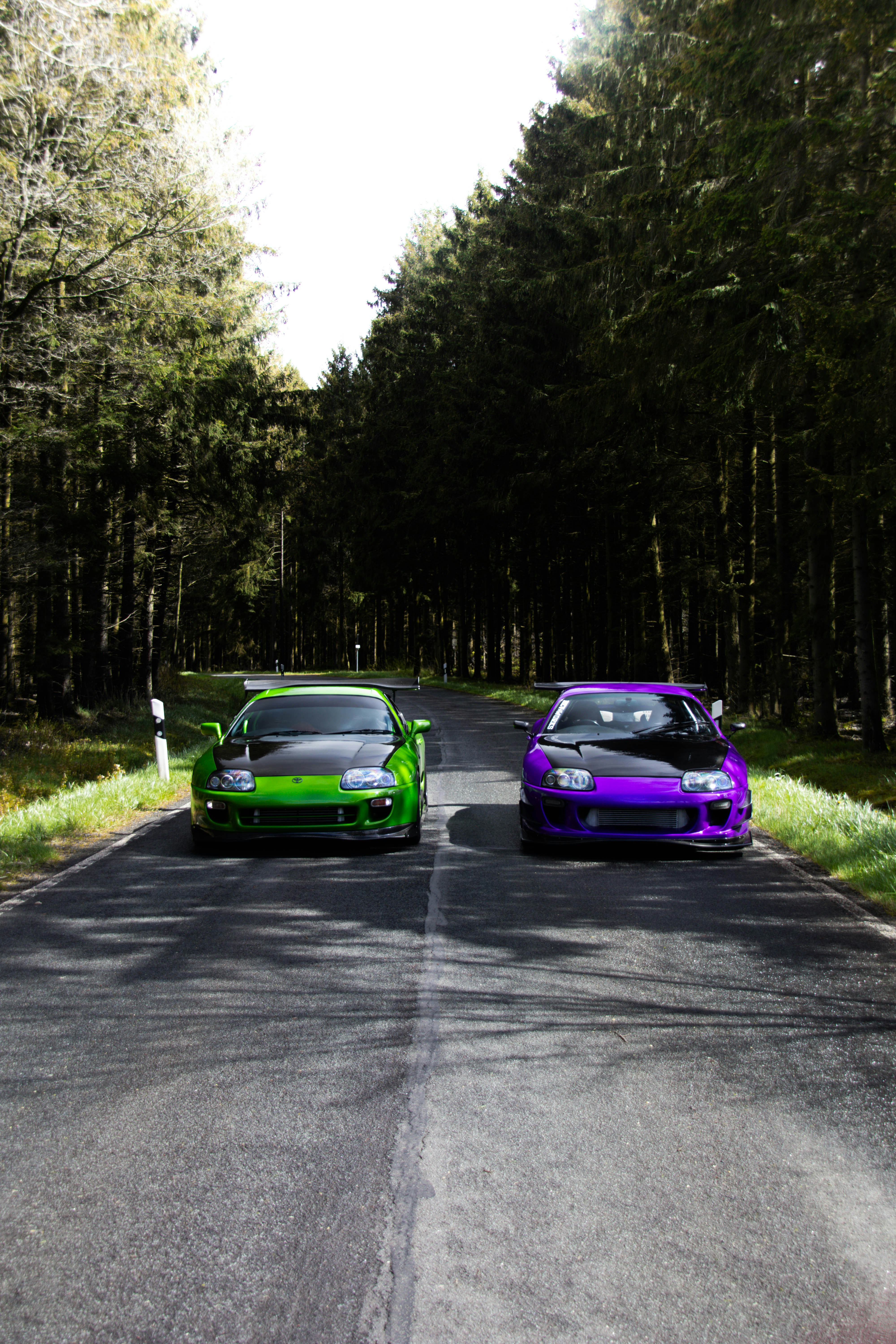 A couple of cars that are sitting in the street