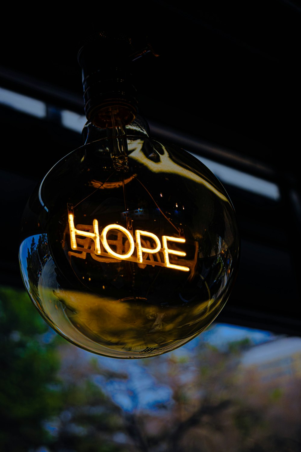 a light bulb with the word hope written on it