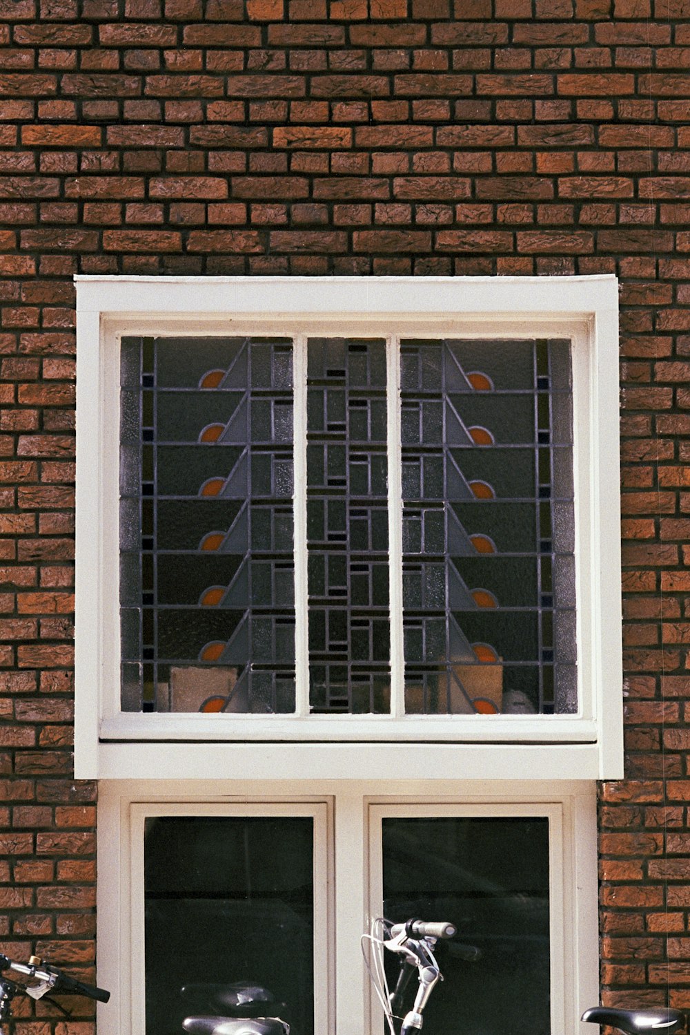 a bicycle is parked in front of a window