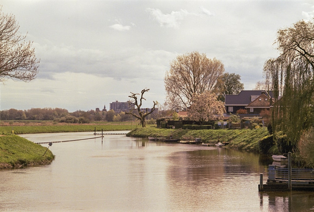 a river running through a lush green countryside