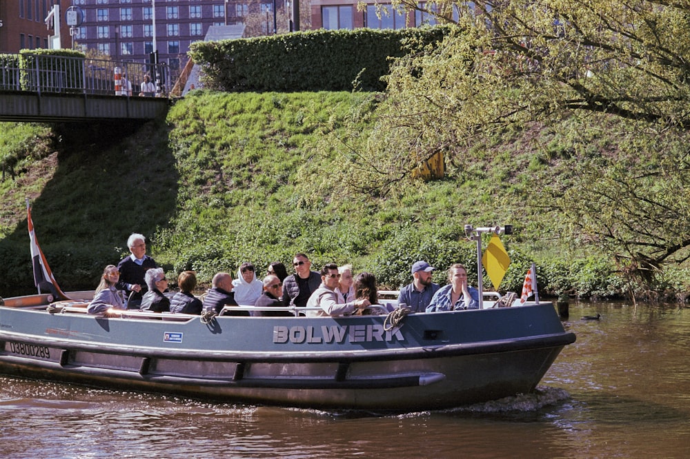 a group of people riding on the back of a boat