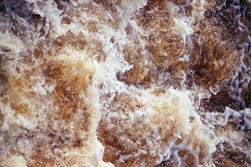 a close up of a wave on a beach