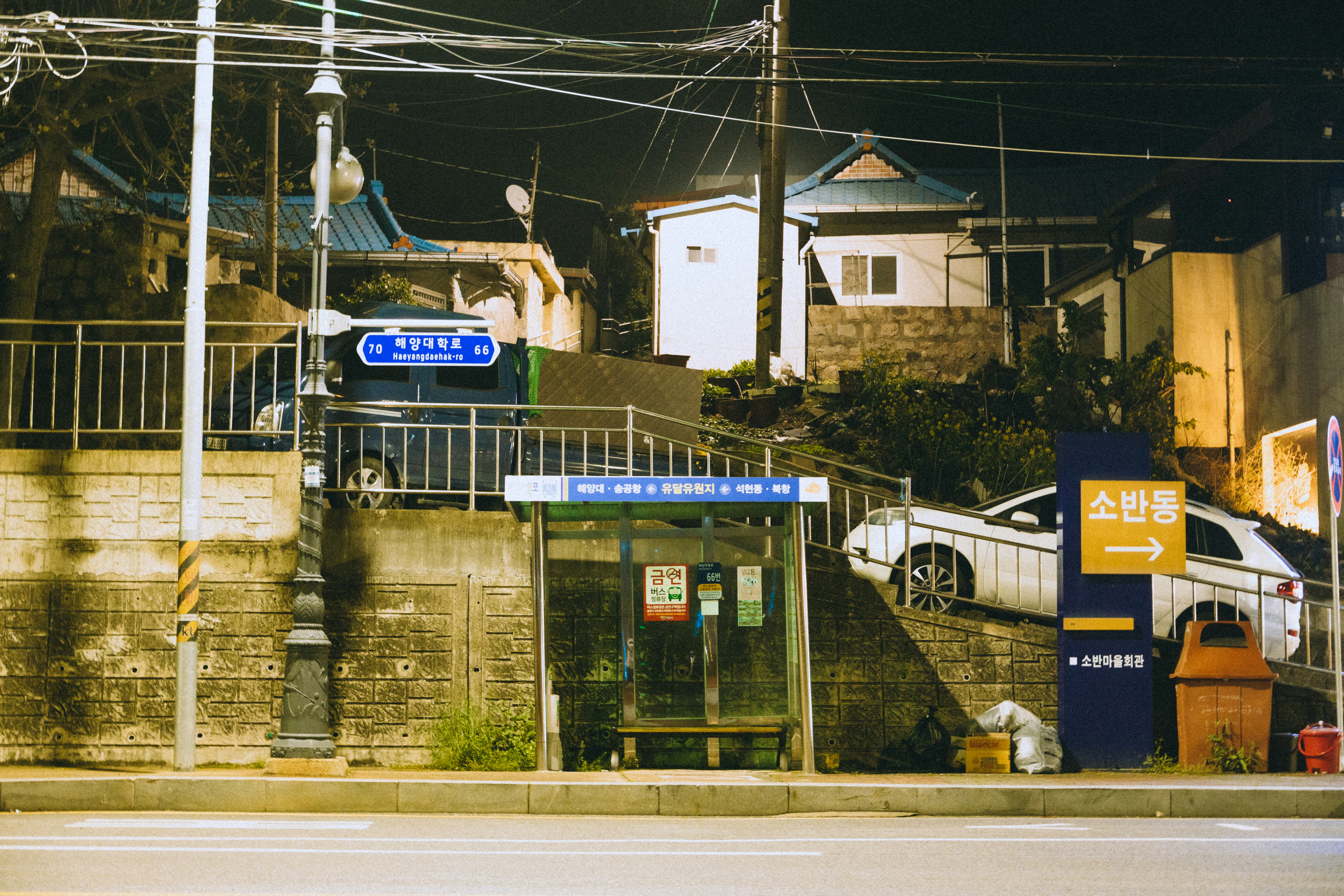 a car parked in front of a building next to a street