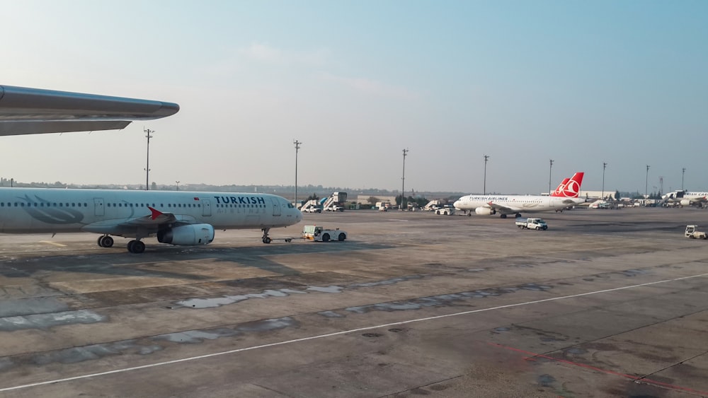 a large jetliner sitting on top of an airport tarmac