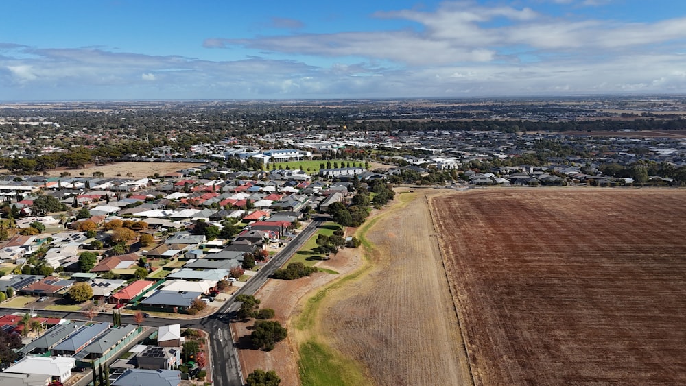 an aerial view of a small town with lots of houses