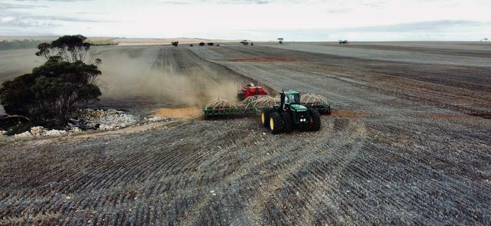 a tractor plowing a field with a plow