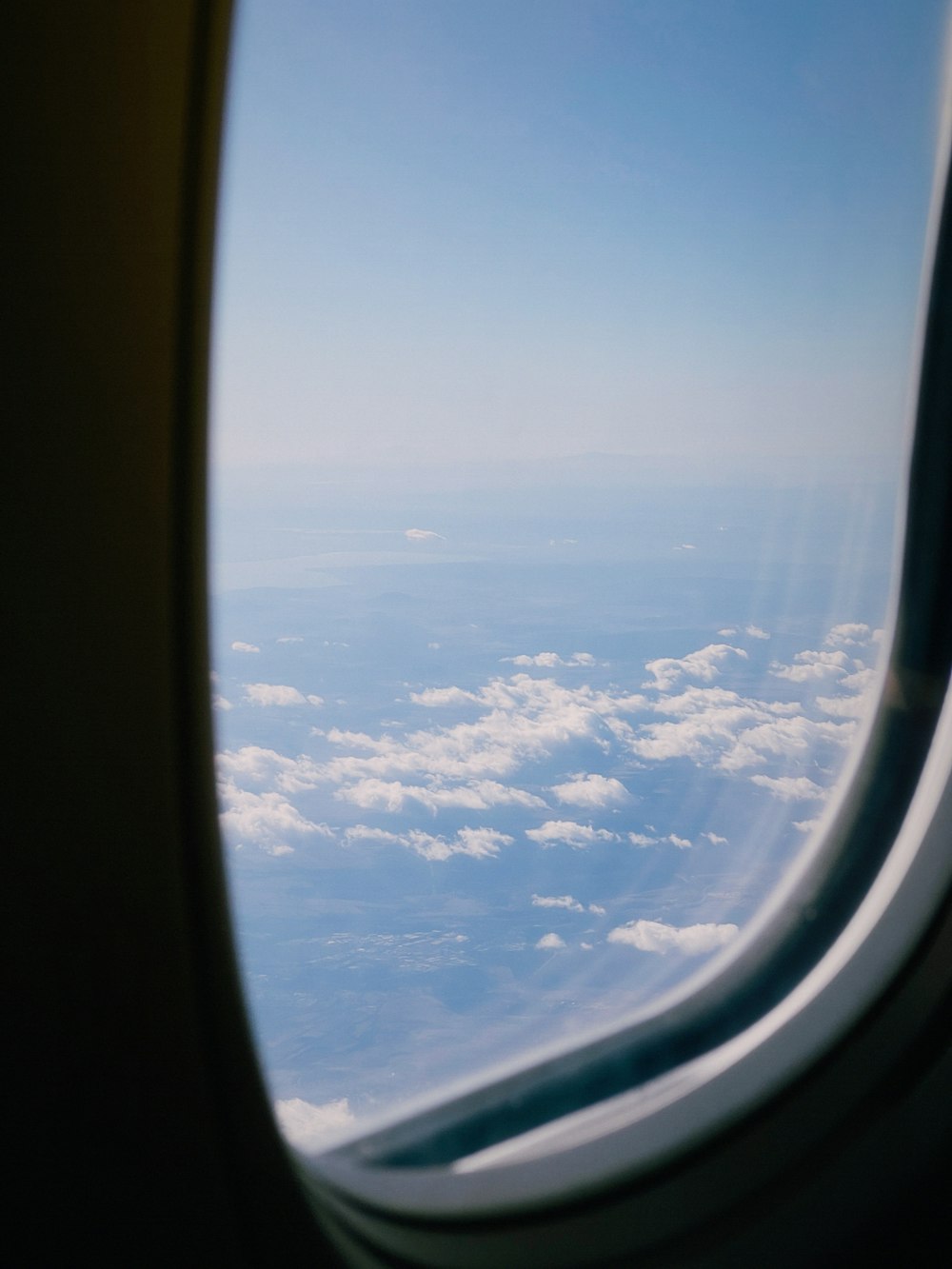 a view of the clouds from an airplane window