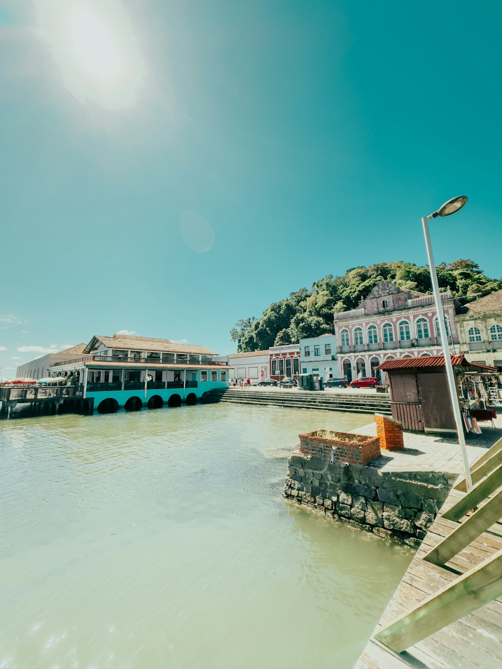 a body of water next to a pier