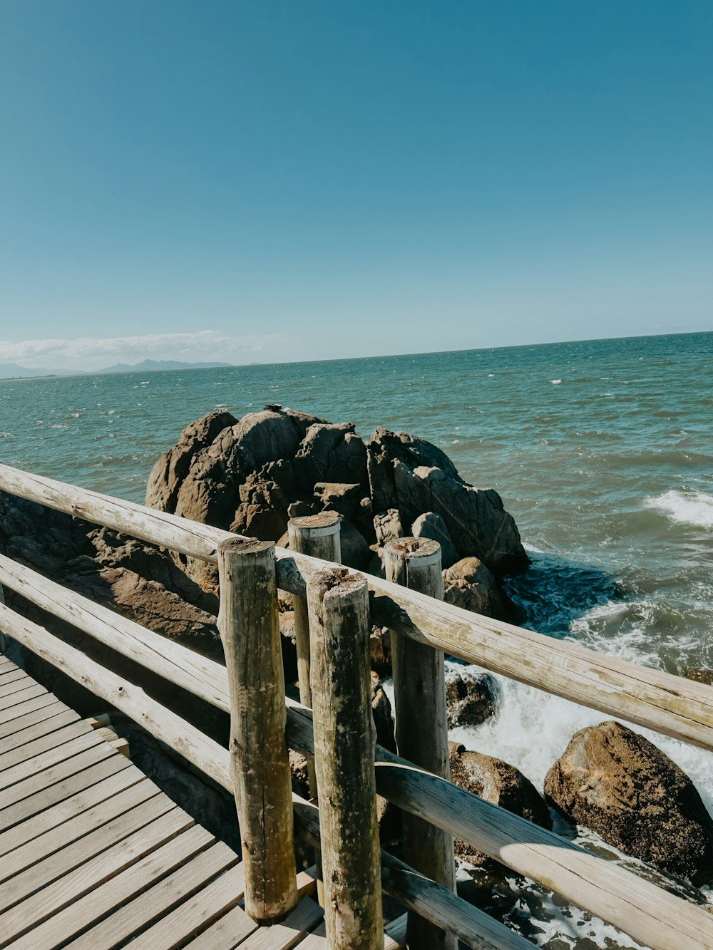 a wooden bridge over a body of water