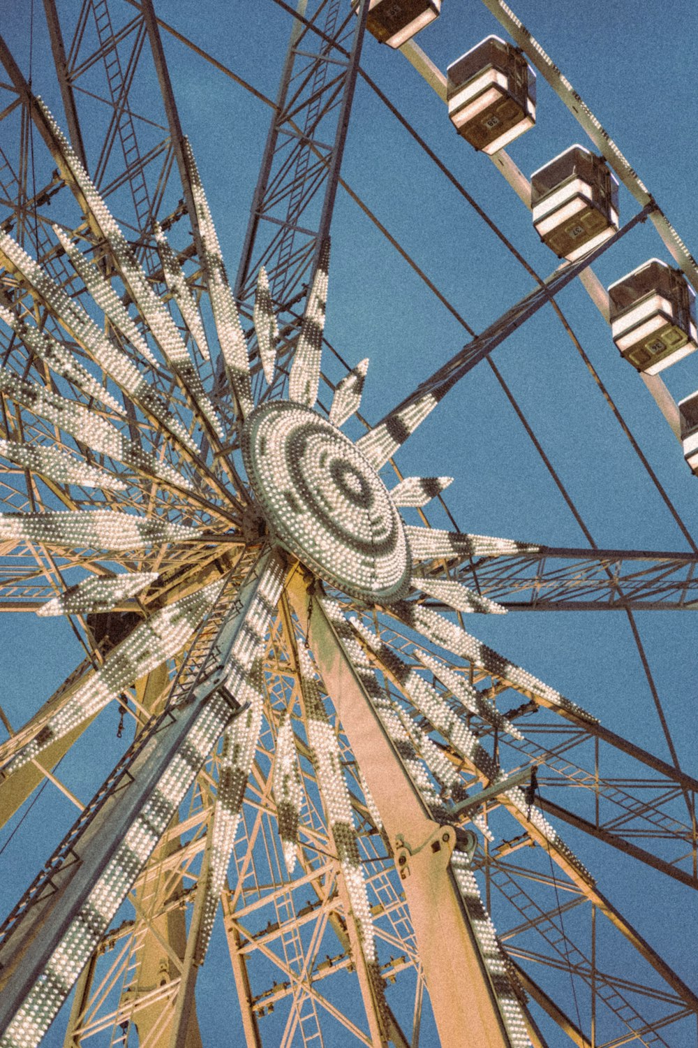 a ferris wheel with a blue sky in the background