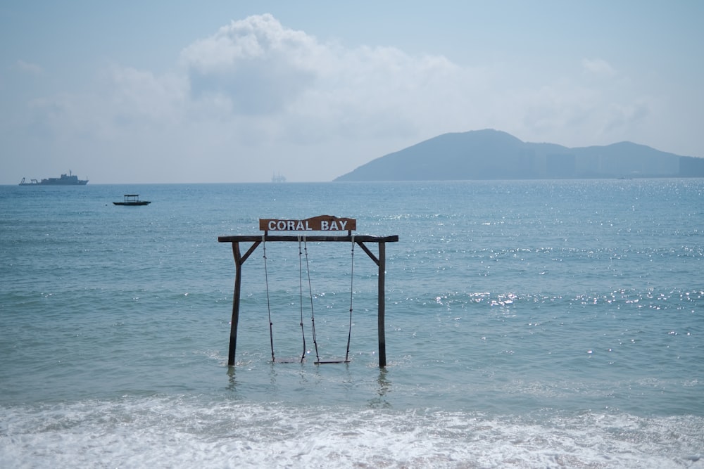 a sign that is sitting in the water