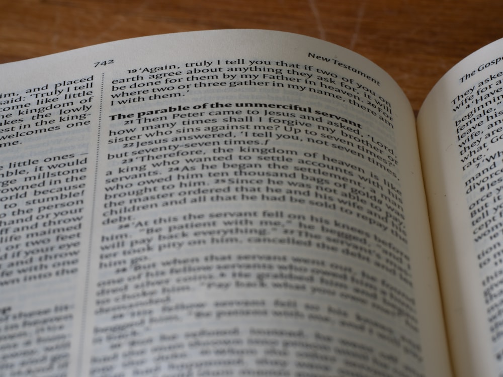 a close up of an open book on a table