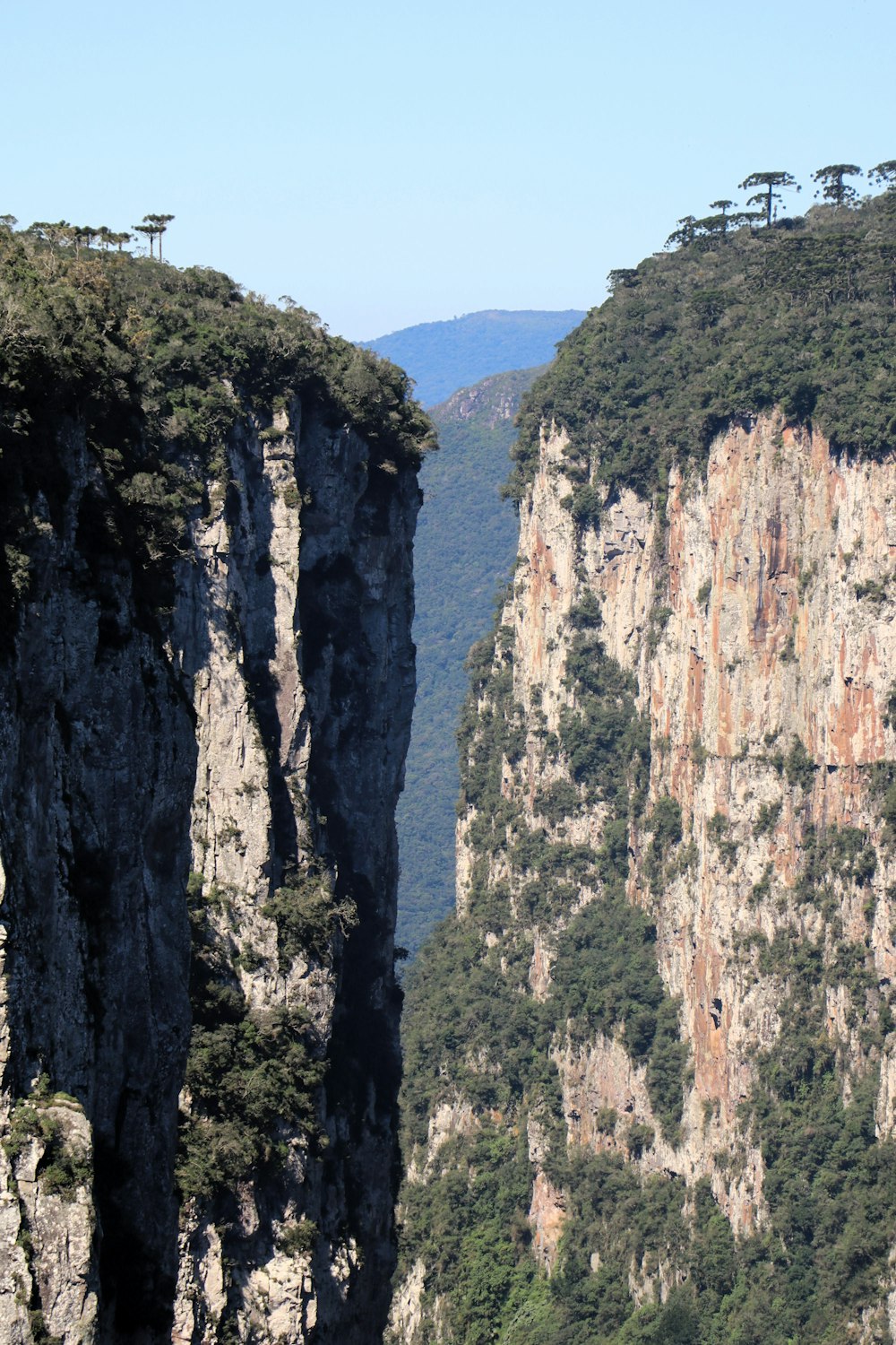 a view of the mountains from the top of a cliff