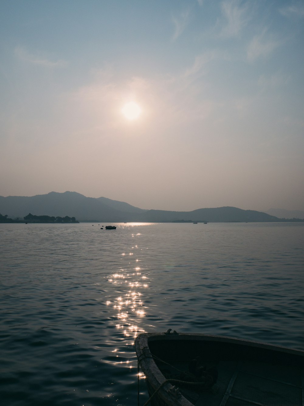 a boat floating on top of a large body of water