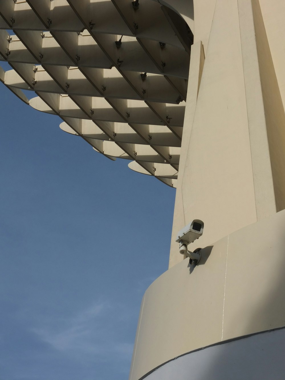 a close up of a building with a sky in the background