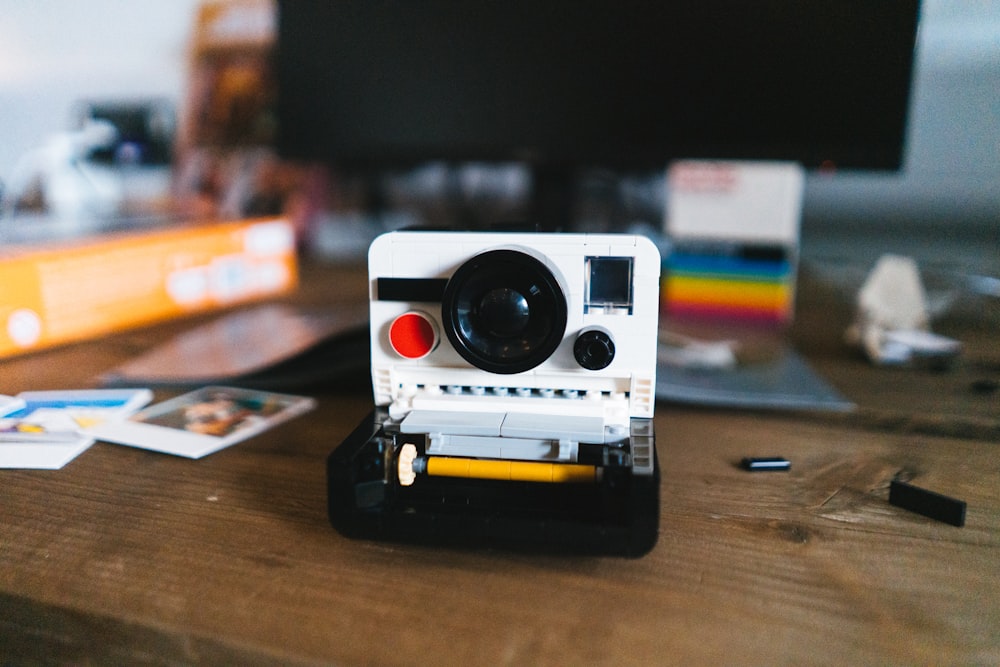 a camera sitting on top of a wooden table