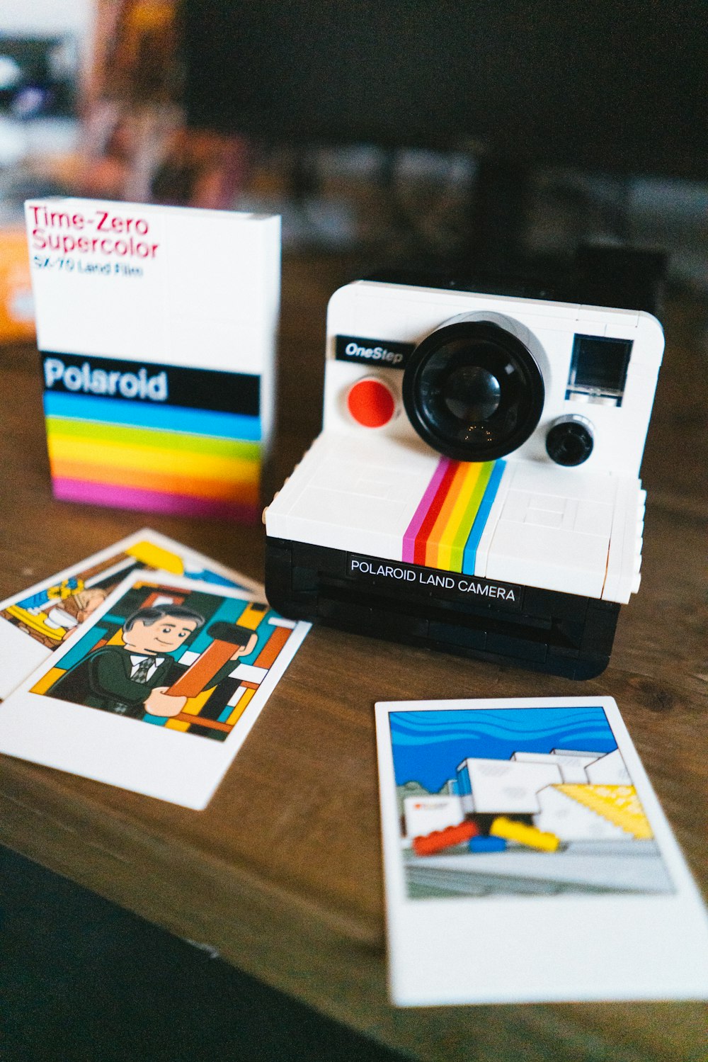 a polaroid camera sitting on top of a wooden table