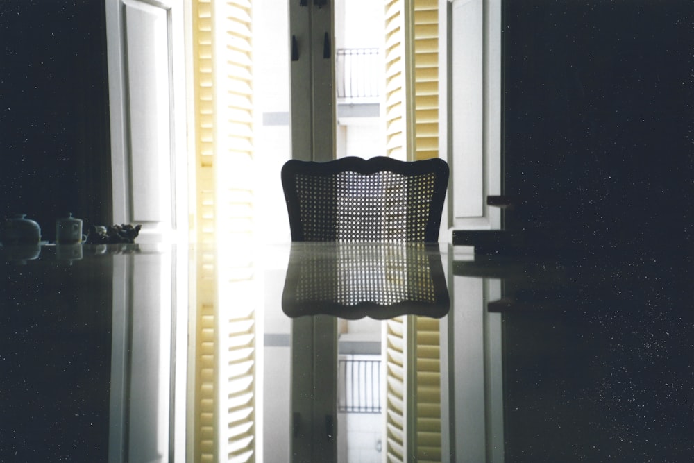 a chair sitting in front of a window