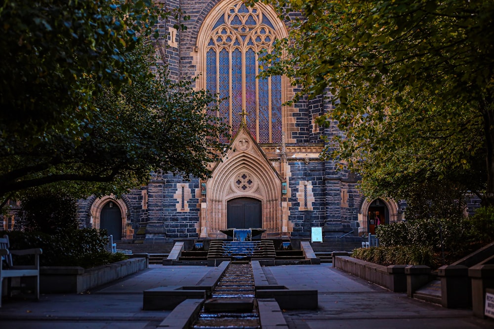 a church with a fountain in front of it