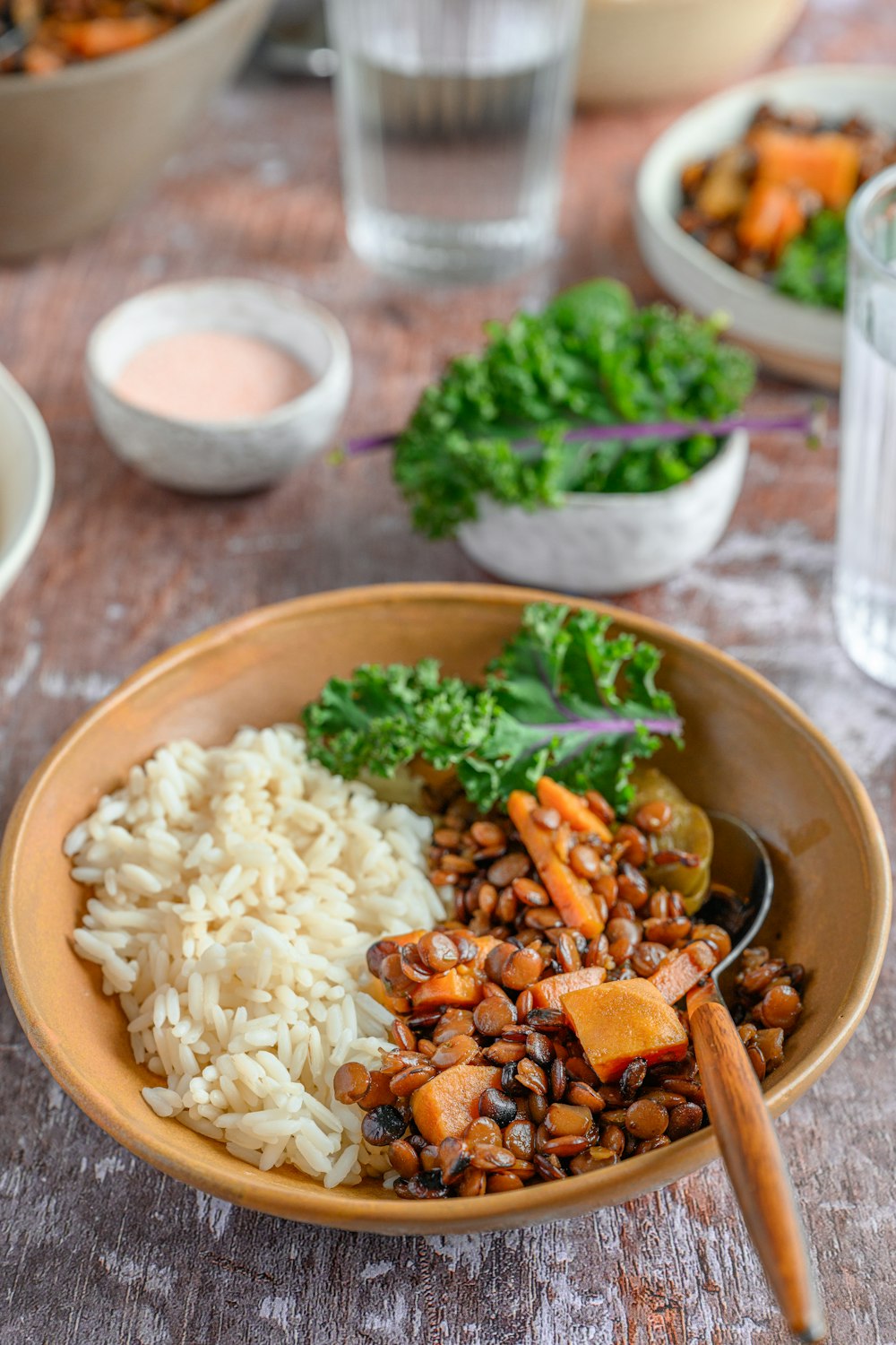 a bowl filled with rice, beans and vegetables