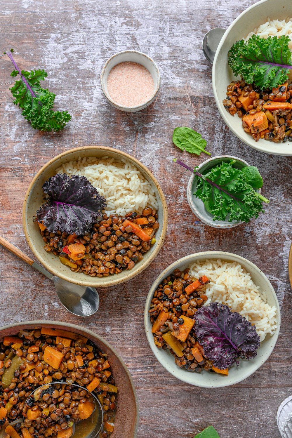 a table topped with bowls filled with different types of food