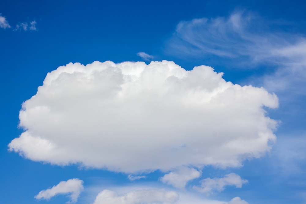 a large white cloud in a blue sky