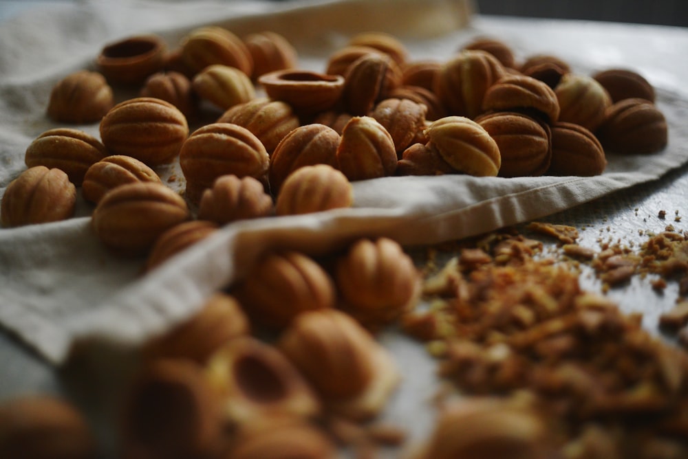 a pile of nuts sitting on top of a table