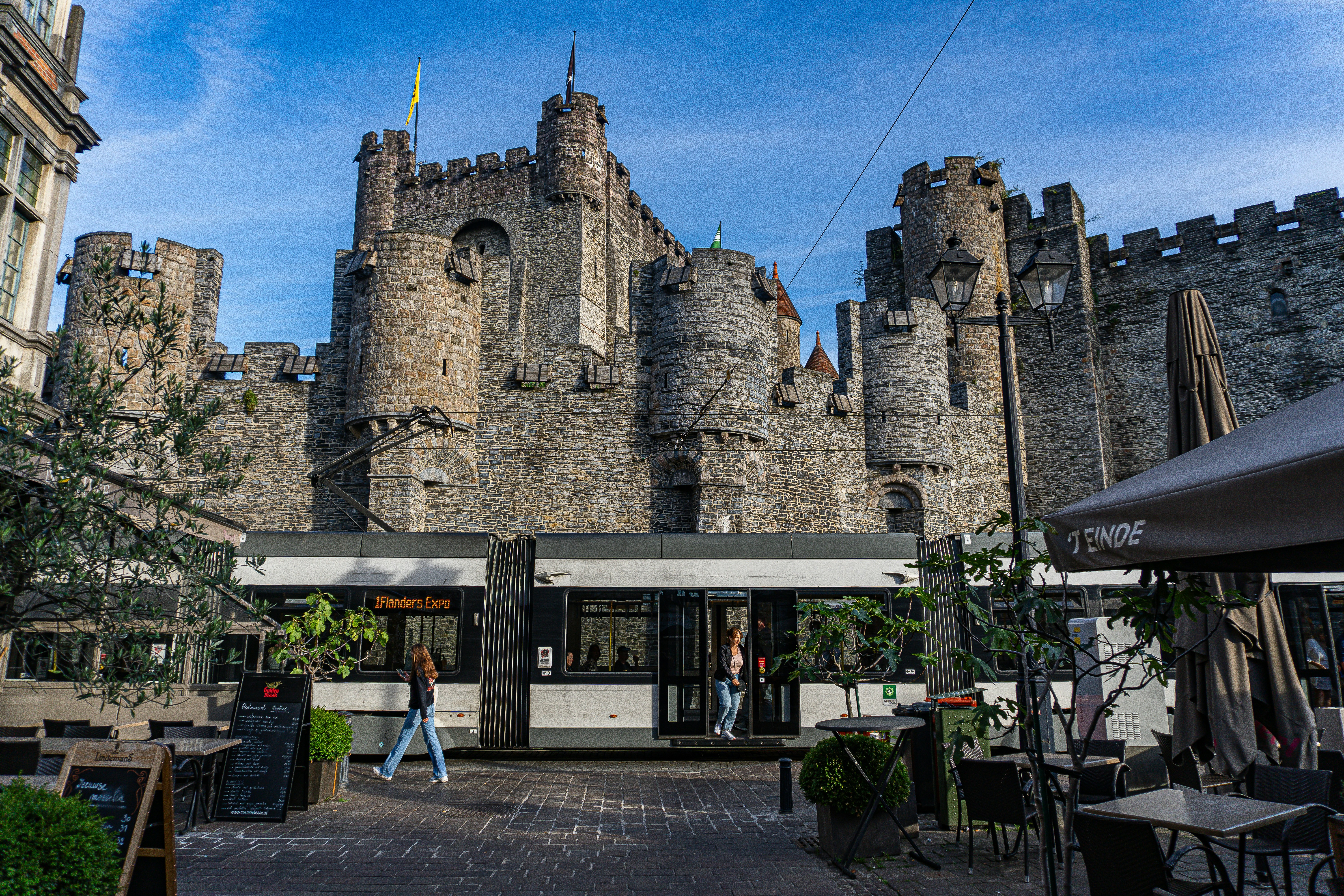 a castle like building with people walking around it