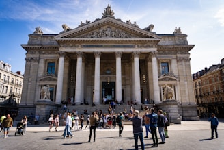a group of people standing in front of a building