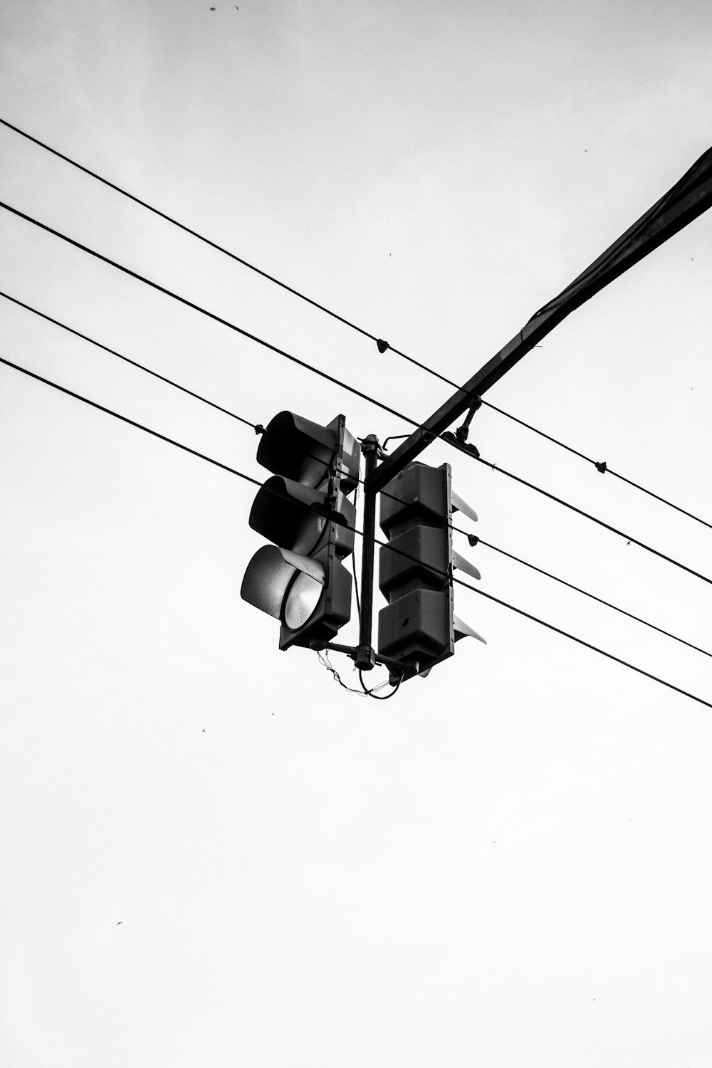 a black and white photo of a traffic light