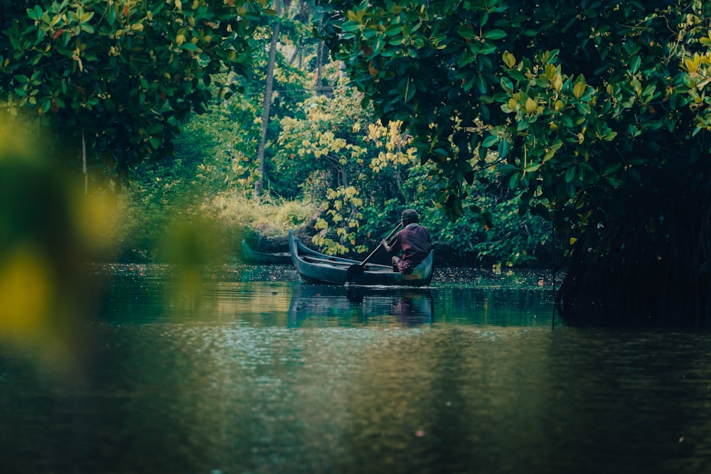 a person riding a boat on a body of water