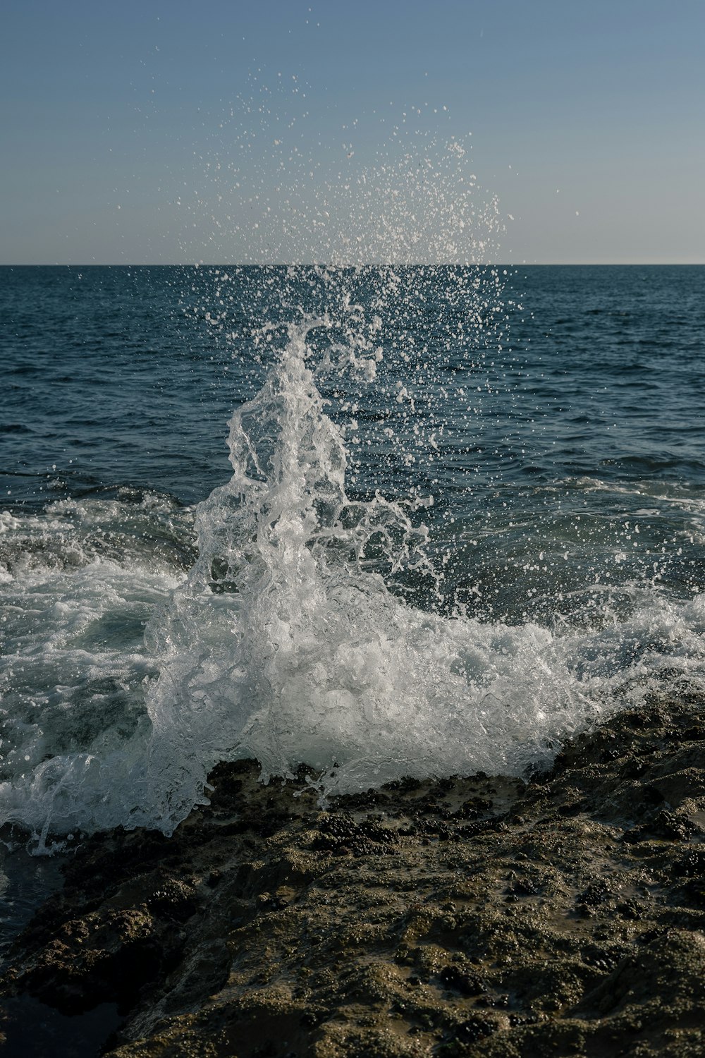 a large body of water with a wave coming out of it