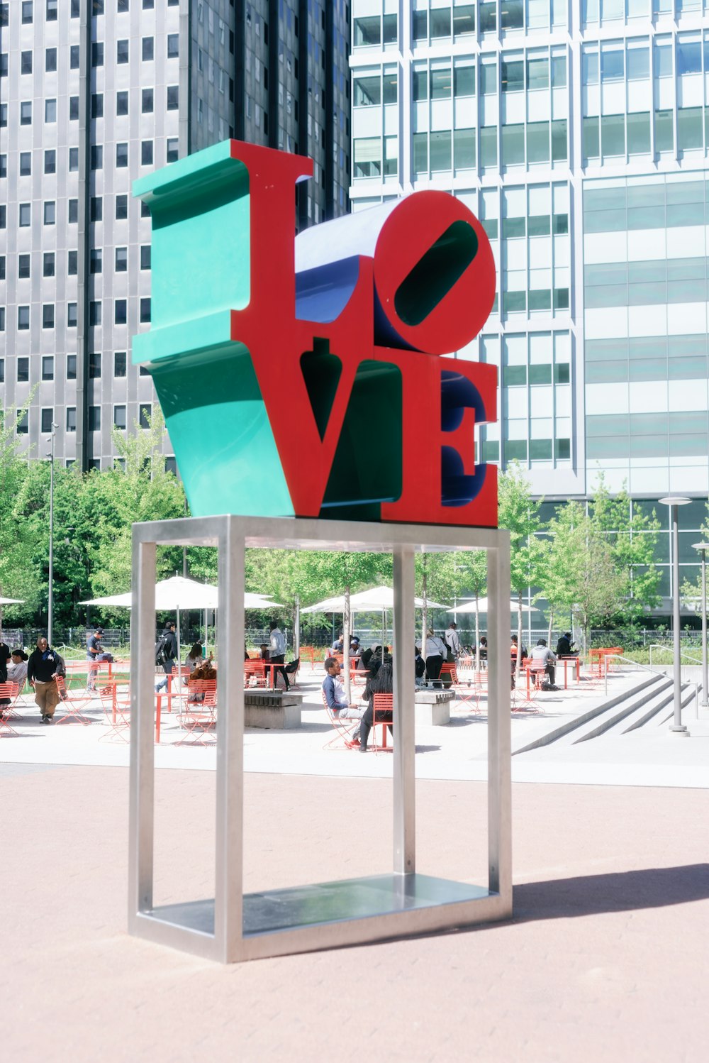 a sculpture of the word love in a city park